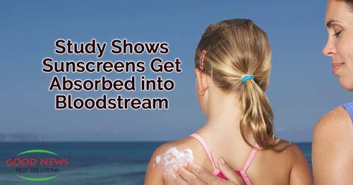 a woman applying sunscreen to a child's back at the beach.