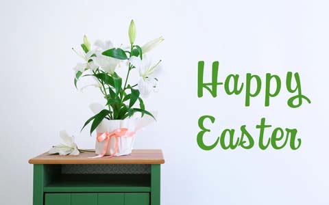 Fresh flowers and a green "Happy Easter" message create a warm spring feeling.